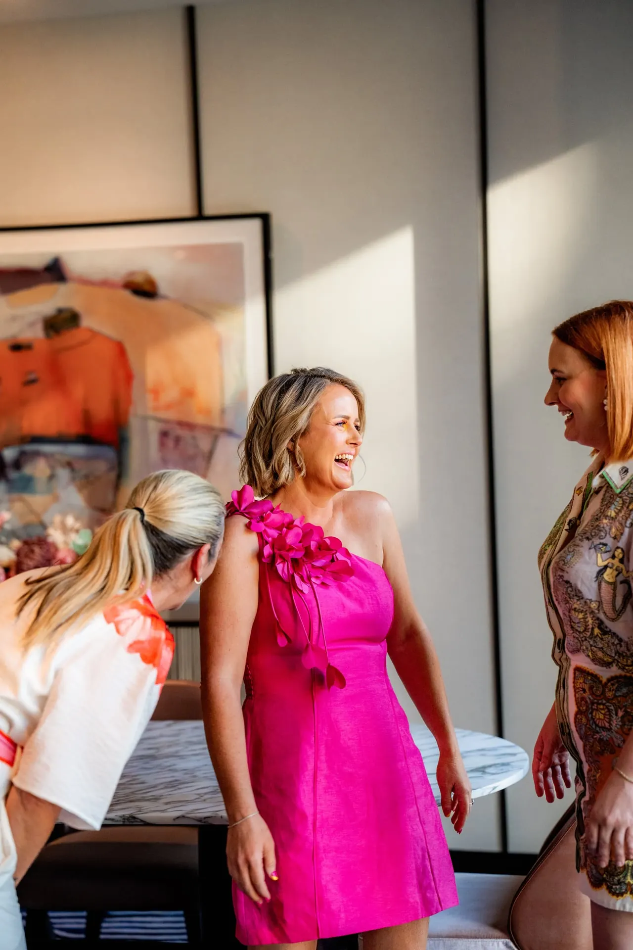 Beck Smith laughing with members inside the Haus